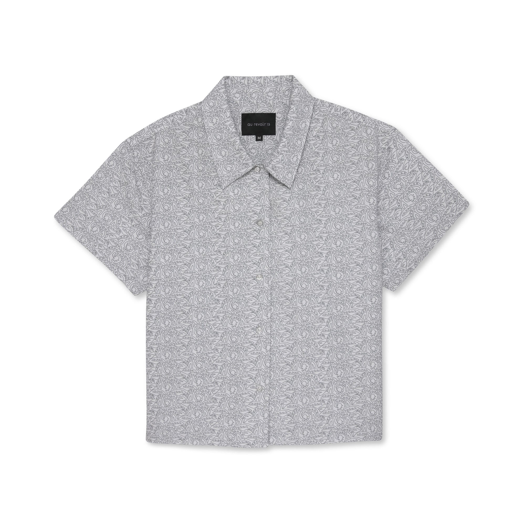 Short-sleeve button-down shirt with a subtle white leaf pattern on a white background.