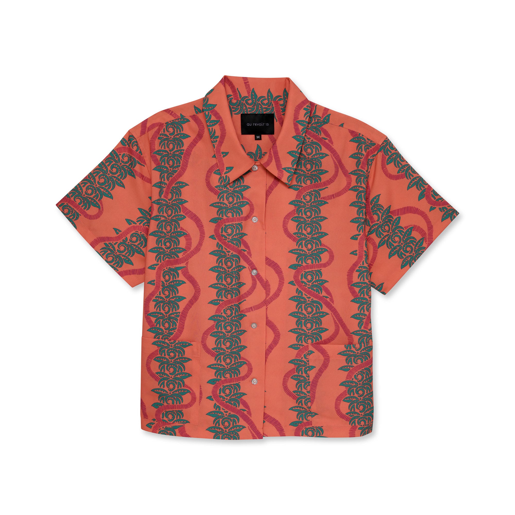 Pink button-down shirt with green leaf pattern on a white background.