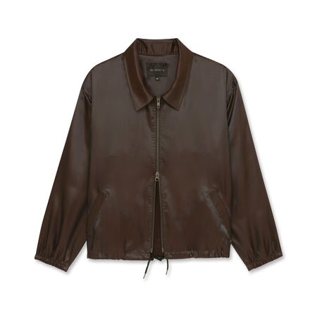 Iridescent copper jacket with double zippers and black drawstrings, displayed on a white background.