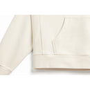 Bottom of body and arm ribbing detail of natural, off-white hoodie.