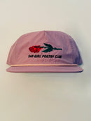 "Embroidered lavender hat featuring a red flattened rose with a green stem, and black text underneath that reads 'Sad Girl Poetry Club'"