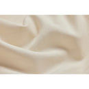 Close-up of natural, off-white fabric with folds
