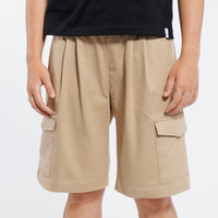 Khaki Bermuda shorts worn by a person on a white background.